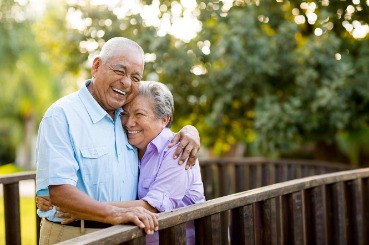 couple, outdoors, deck, laughing, happy, retiree