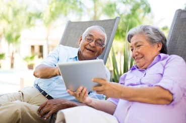 couple, retirees, tablet, outdoors, chairs, banking